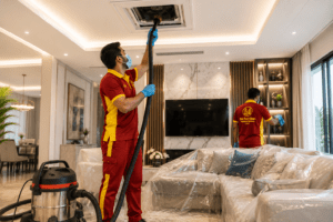 Professional technician performing AC duct cleaning in Dubai